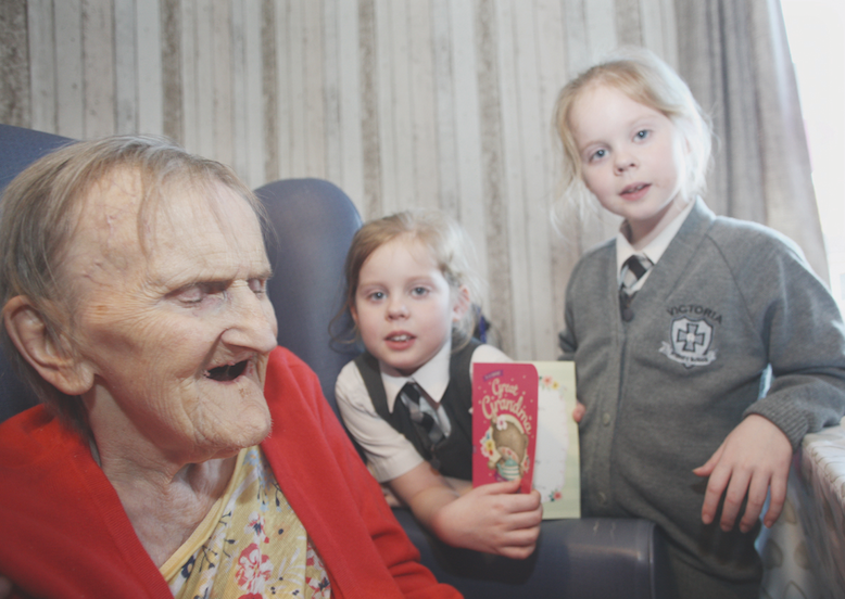 MILESTONE: Edith Manderson celebrates her 100th birthday with her great-grandchildren, Jessica and Rachel McConnell, both aged seven
