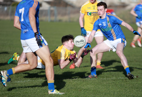 Antrim’s Ryan Murray spills possession under pressure from Wicklow’s Ross O’Brien and Cathal Magee during yesterday’s draw at Corrigan Park