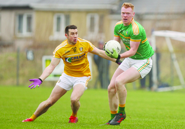 Antrim’s Conor Murray, pictured in action against Leitrim’s Colm Moreton on the opening day of league action, believes Sunday’s round three game against Wicklow will be the toughest game the Saffrons have faced to date in their Division Four campaign 