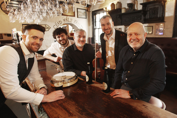 CLASS ACT: Shane McNeill, Seán Mac Corraidh, Gerry McNeill, Seán óg Mac Corraidh and Stephen Loughran in Kelly’s Cellars re-enacting a famous photo of the Dubliners in Kelly’s from 1968