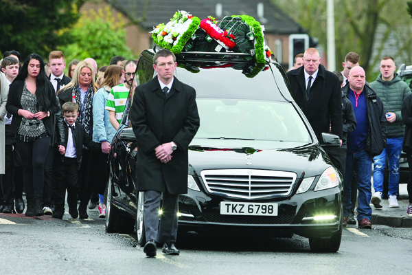 Mourners gather at the Church of Nativity on Monday