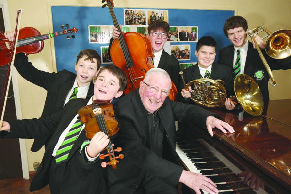 RIGHT NOTE: Fr Kevin McMullan with musical pupils of St Malachy’s preparing to entertain at the inaugural Alumni Recital this Thursday night