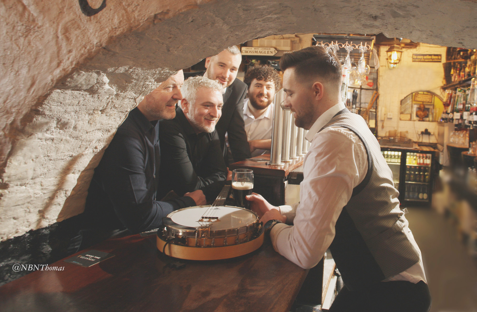 SLÁINTE: Shane McNeill, Seán Mac Corraidh, Gerry McNeill, Seán óg Mac Corraidh and Stephen Loughran look forward to the gig with a relaxing pint in Kelly’s