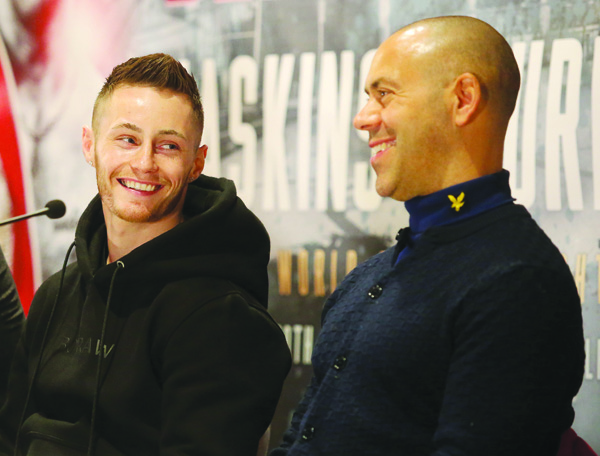 Ryan Burnett’s trainer, Adam Booth (right) says his man must first win the fight before he starts thinking about putting on a show in front of the 80,000 crowd at the Principality Stadium in Cardiff on Saturday night