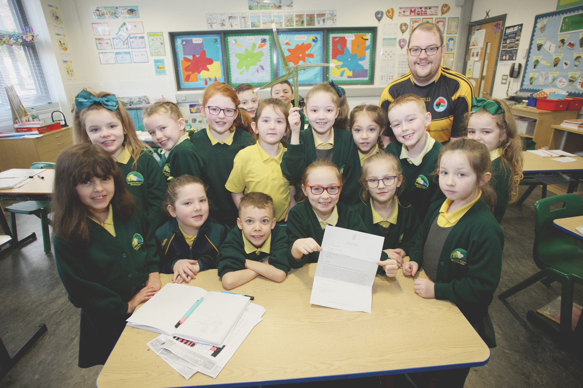 REED ALL ABOUT IT: Teacher Diarmuid Ó Tuama with his class and the letter from Taoiseach Leo Varadkar