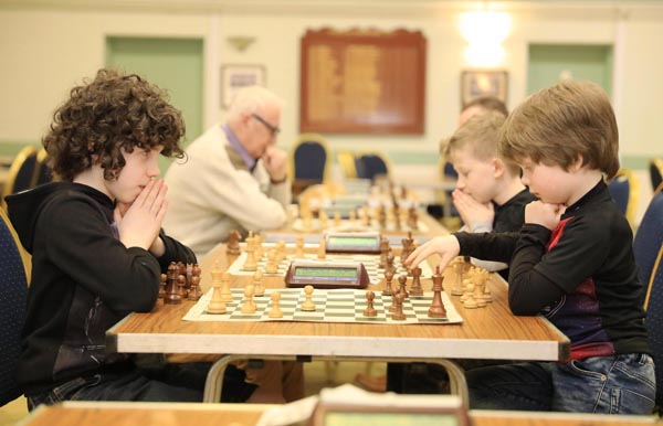 At the Ulster Rapidplay Chess Championships 2018 in Fruithill Bowling Club, Dexter Harris (9) waits for his brother Blake (6) to make his move