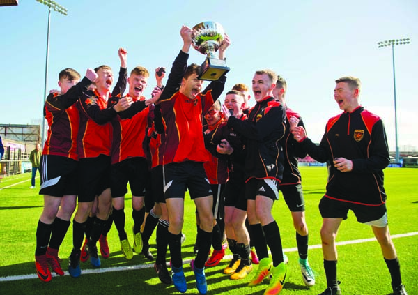De La Salle capt Calvin McCurry celebrates with his team after their victory over Edmund Rice during the u16 schools cup final at Seaview stadium in North Belfast.  Picture Mark Marlow