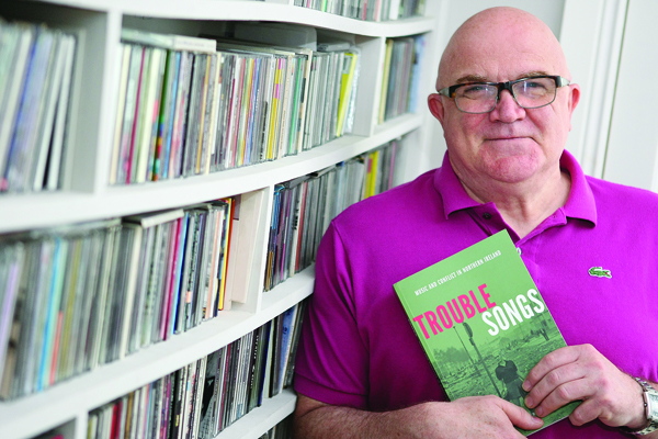 Stuart Baille with his new book, Trouble Songs.