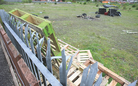 ‘PIGSTY’: Pallets and tyres have been gathered on the green field
