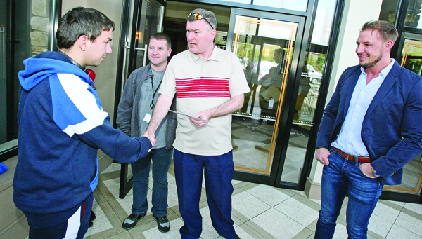 DREAM COMES TRUE: Eamonn Christie and Jim Conlon present Stephen McAllister with VIP gold tickets for an exhibition snooker match between Ronnie O\'Sullivan and Mark Allen in the Devenish with Councillor Ciarán Beattie looking on