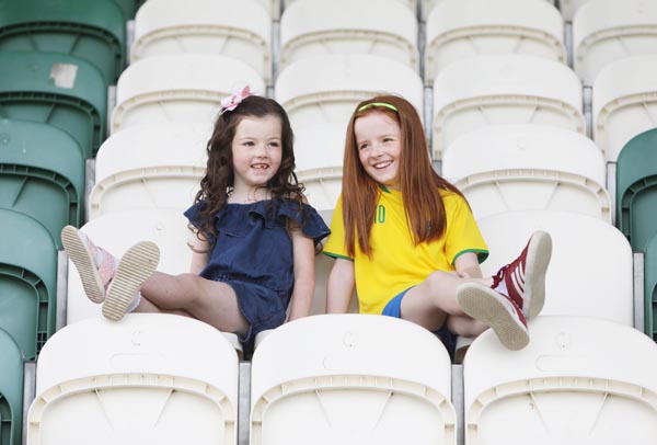 Watching a charity football game in honour of Macy Brady at the Donegal Celtic pitch from the cool of the shade  are cousins Eva Carville and Ruby Brady