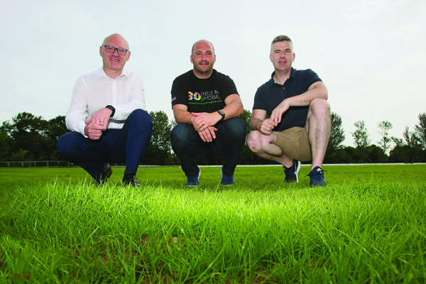 The grass is sprouting up at the Event Space in the Falls Park.\nPictured are West Belfast MP Paul Maskey, Féile Director Kevin Gamble and Sinn Féin Councillor Stevie Corr.