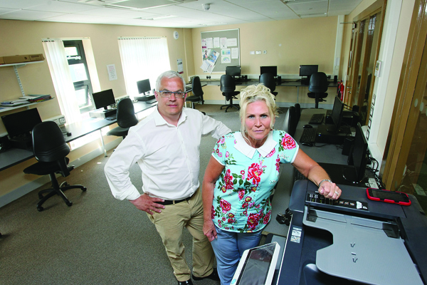 Councillor Tim Attwood and Sharon McCullough Training Co-ordinator at the Lenadoon Community Forum