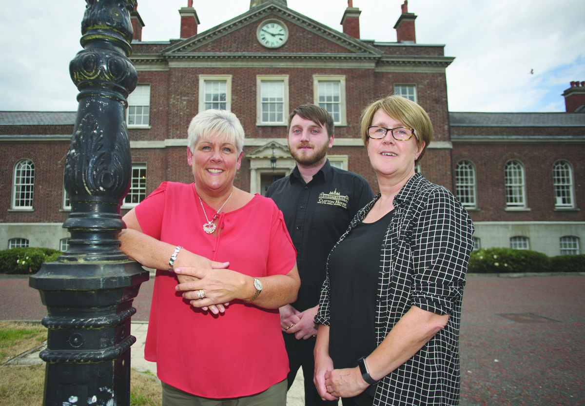 Caption- HISTORY: Cathy Megahey (Project Support Officer) Aaron McIntyre (Tour guide) and Paula Reynolds (Chief Executive, Belfast Charitable Society)