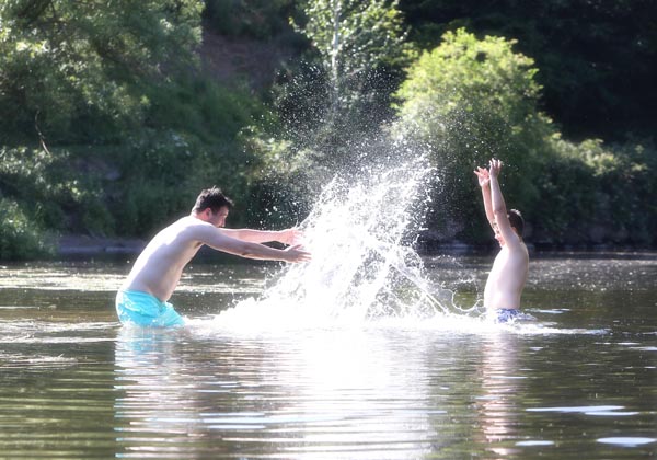 Louis Hyndman and Gerard McAnoy making a splash on the River Lagan near Minnowburn