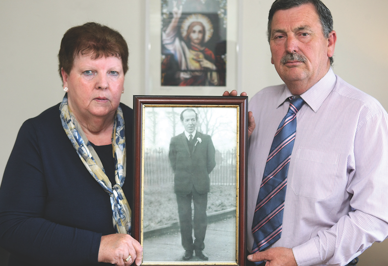 SHOT DEAD: John Teggart and Alice Harper with a photo of their father Danny