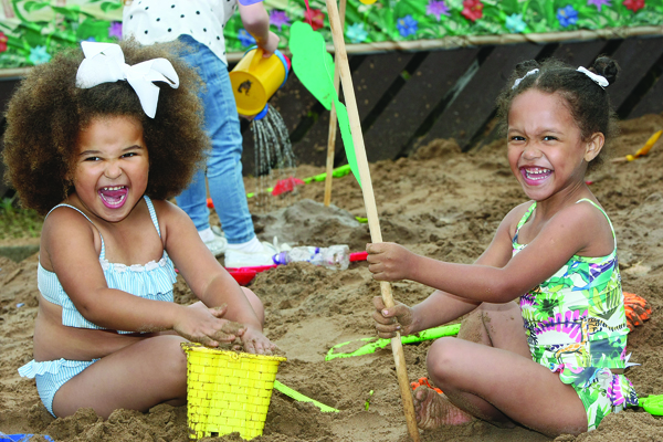 Jasmin Ojo and Nevaeh Commander enjoy ‘A Day at the Beach’ as the Star Neighbourhood Centre transformed into a beach for the New Lodge Festival