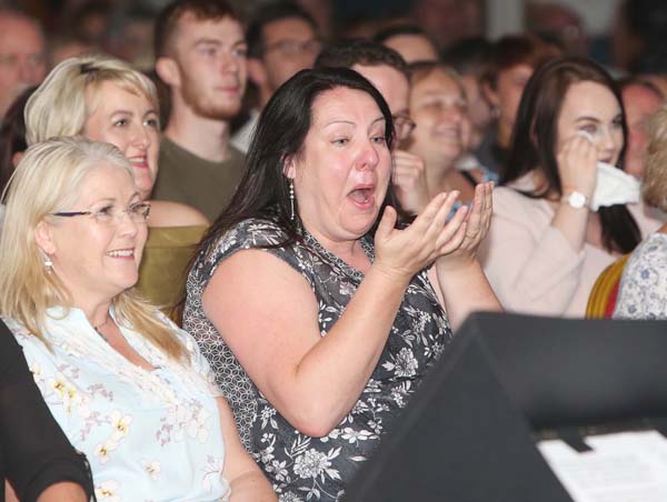 FUNNY BUSINESS: An audience member enjoying Jake O’Kane and Paddy McDonnell’s Féile an Phobail comedy night performance in the Devenish on Saturday night