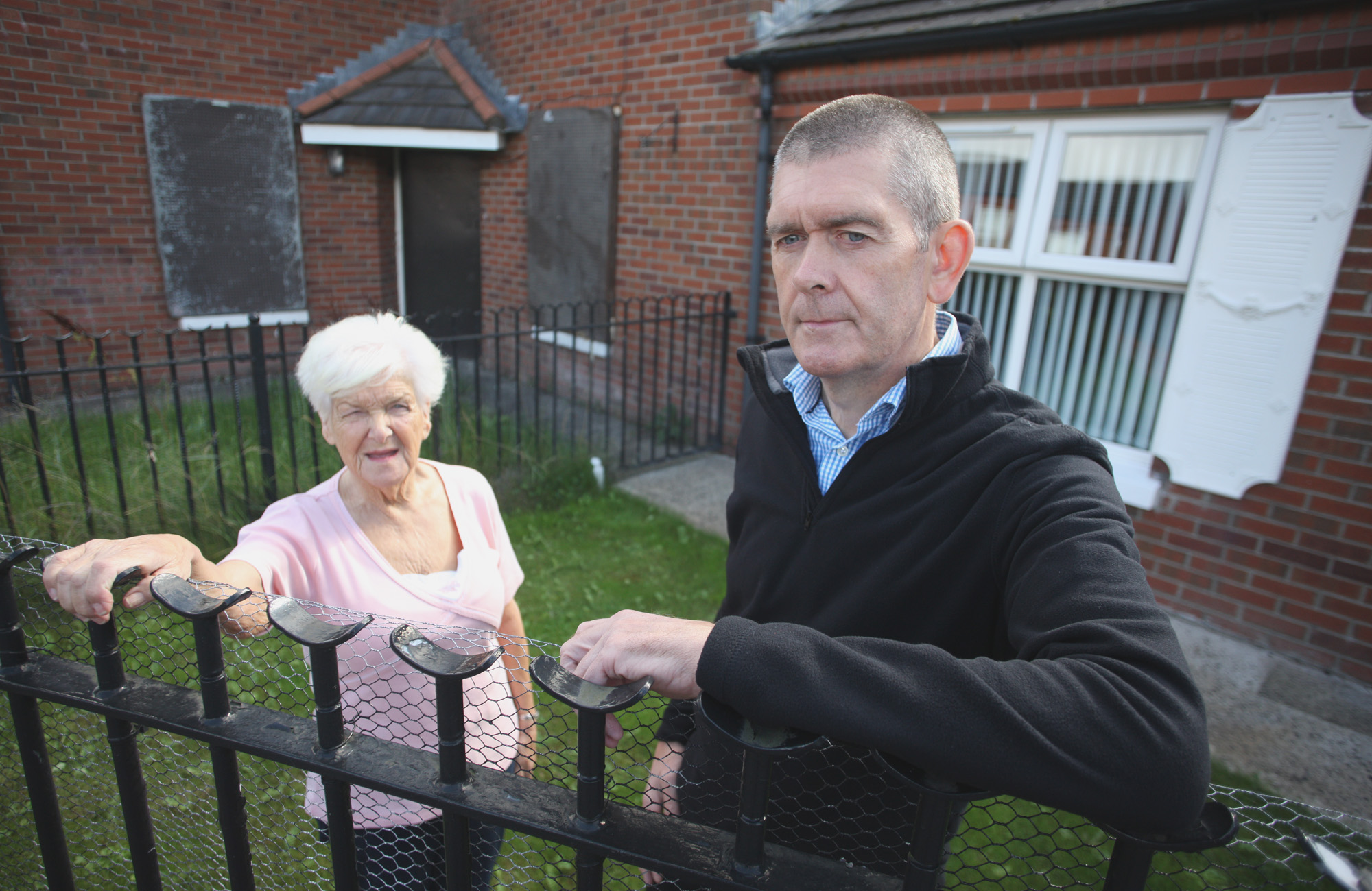 ENOUGH: Manus Maguire with resident Joan Rocks at the derelict house in Manor Close