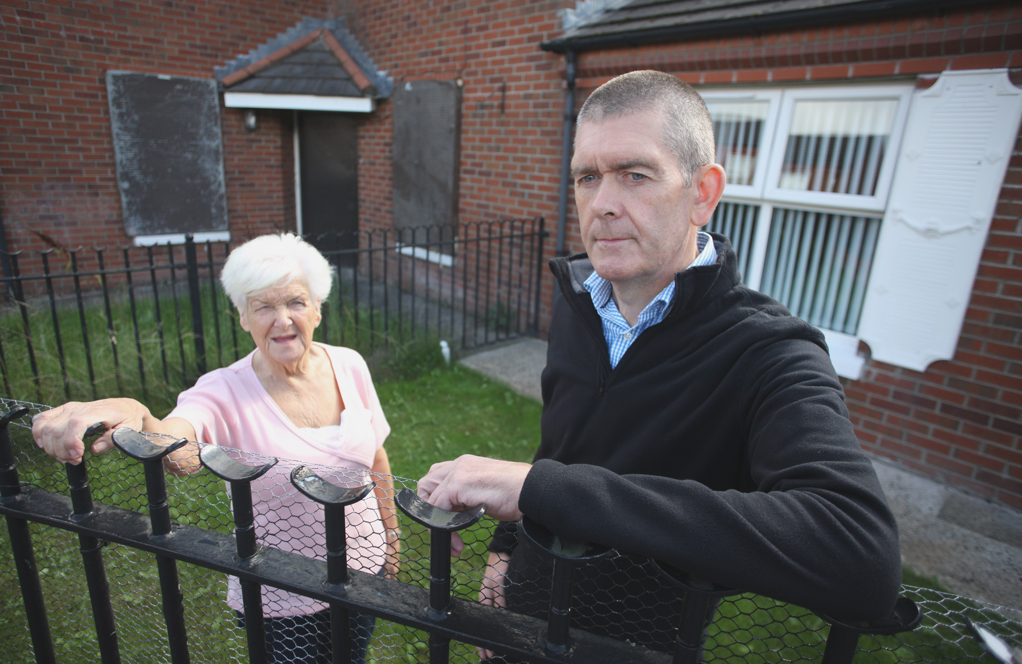 ENOUGH: Manus Maguire with resident Joan Rocks at the derelict house in Manor Close
