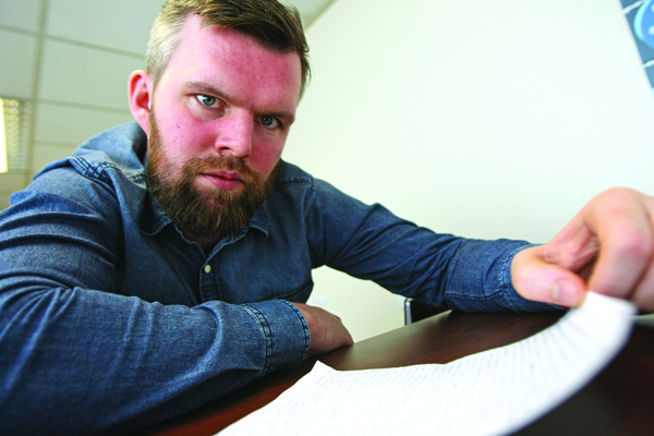 Gerry Carroll of People Before Profit reads a letter from a concerned member of the community about the new PIP benefit scheme.