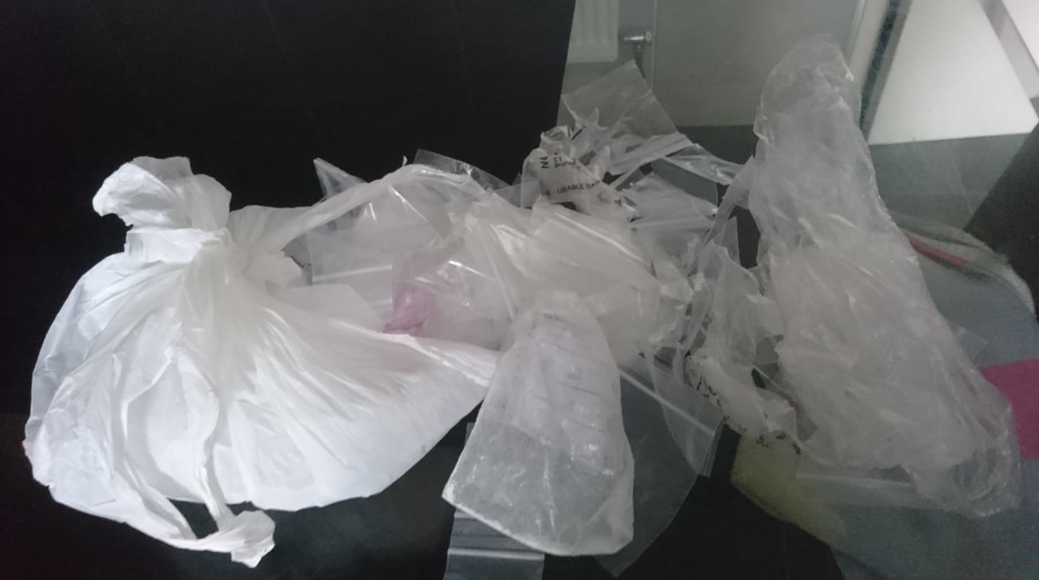 FIND: The large amount of drugs destroyed by the IRSP – several other bags that had formerly contained drugs can also be seen