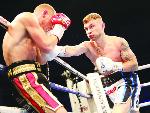 Carl Frampton goes on the offensive against Luke Jackson at Windsor Park on Saturday night\n