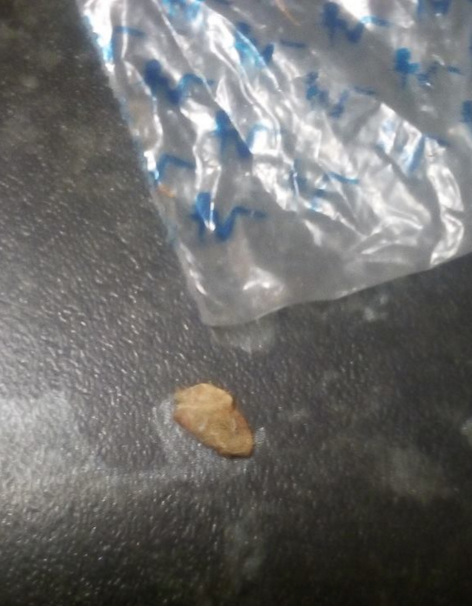 FIND: The bag containing a brown substance believed to be heroin