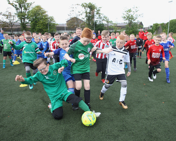 MY BALL: Taking part in a cross community football tournament at St Malachy\'s College Pitch on the Antrim Road