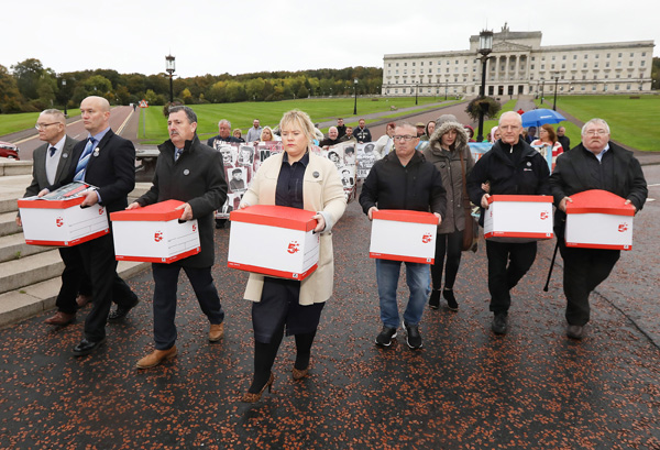 Members of the Time for Truth Campaign hand over 6,000 responses to the NIO’s consultation, addressing the legacy of the past in the North