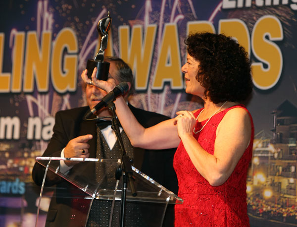 Tish Holland collecting an Aisling Award in 2012
