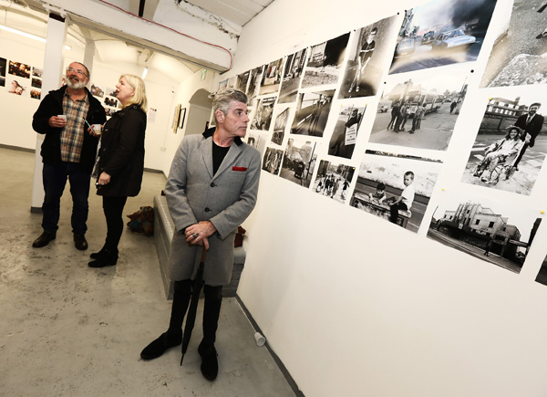 Visitors enjoy the images on show at the Belfast Exposed 35th Anniversary Exhibition sponsored by Kelly\'s Cellars in the Artcetera Studio in Rosemary Street 