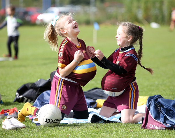 Kaila Walsh and Sophia Lockhart having fun at the St Galls Gaelic 4 Mothers tournament