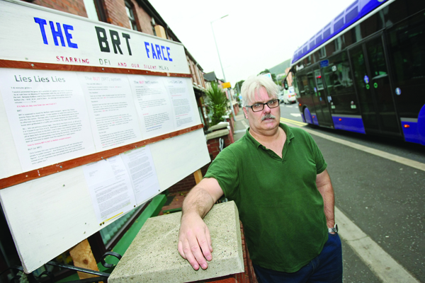 Fintan Heatley has erected a sign outside his Falls Road home entitled The BRT Farce