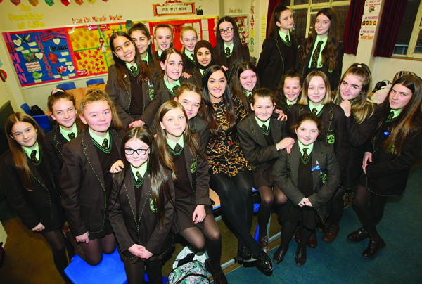 INSPIRATIONAL TEACHER: Alanah McGlinchey with the young students of St Louise’s College