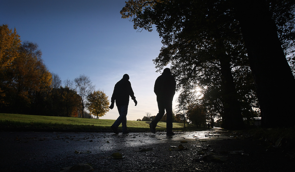 Walkers hop up and stretch their legs on a fresh autumn morning in the Falls Park.