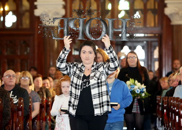 At Suicide Awareness and Support Group\'s annual Mass of Hope in Clonard Nicki Simpson leads the procession carrying the central message