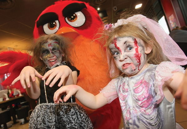 Khole and Halle Magee with Red of Angry Birds who popped in to the Halloween party at McDonald\'s Westwood