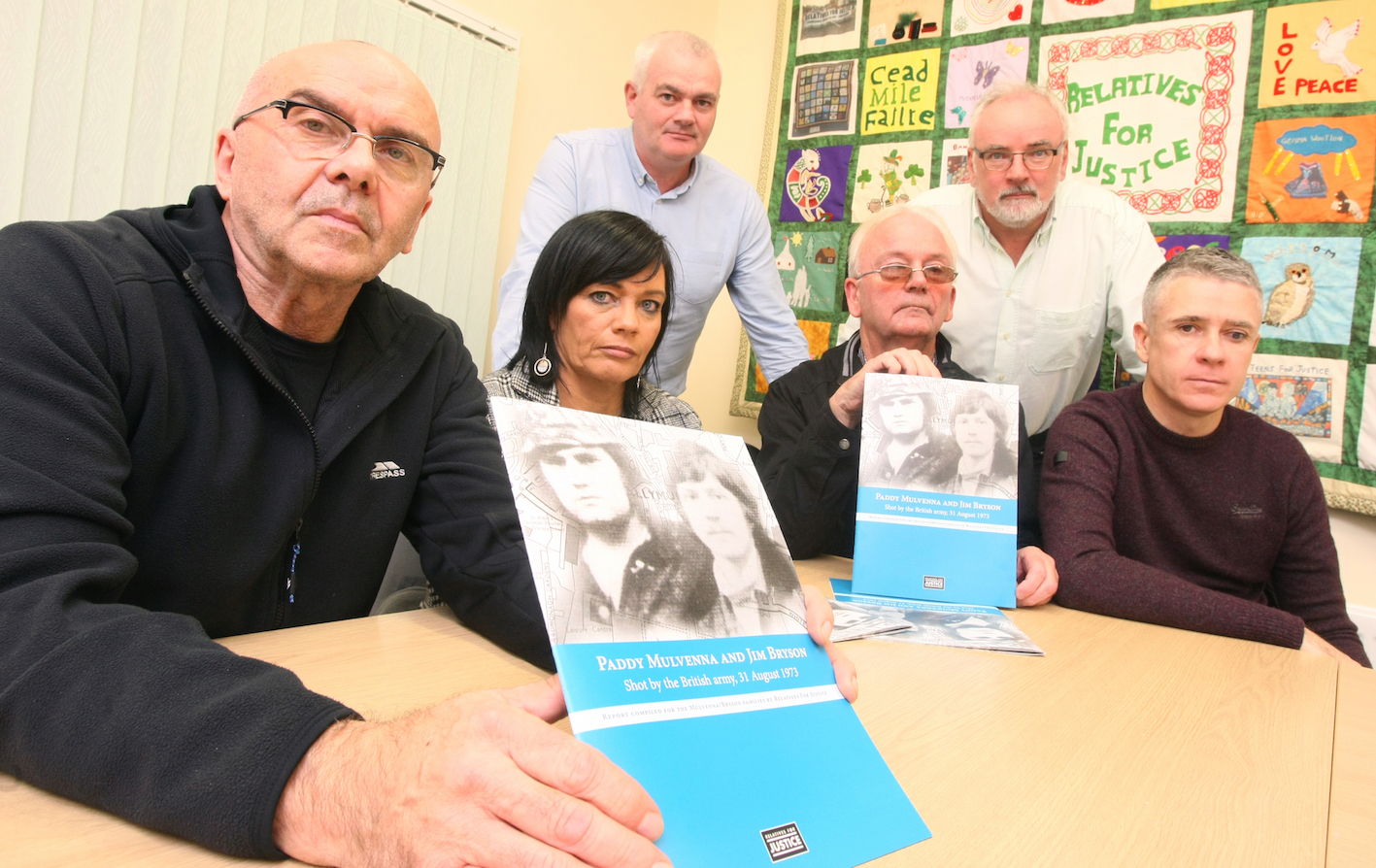 A report by Relatives for Justice into the shooting of Paddy Mulvenna and Jim Bryson.\n\nPictured with RFJ caseworker Paul Butler are Tina McComb, Bill McComb, Frank Duffy, Pat Conway (RFJ caseworker) and Patrick Mulvenna.