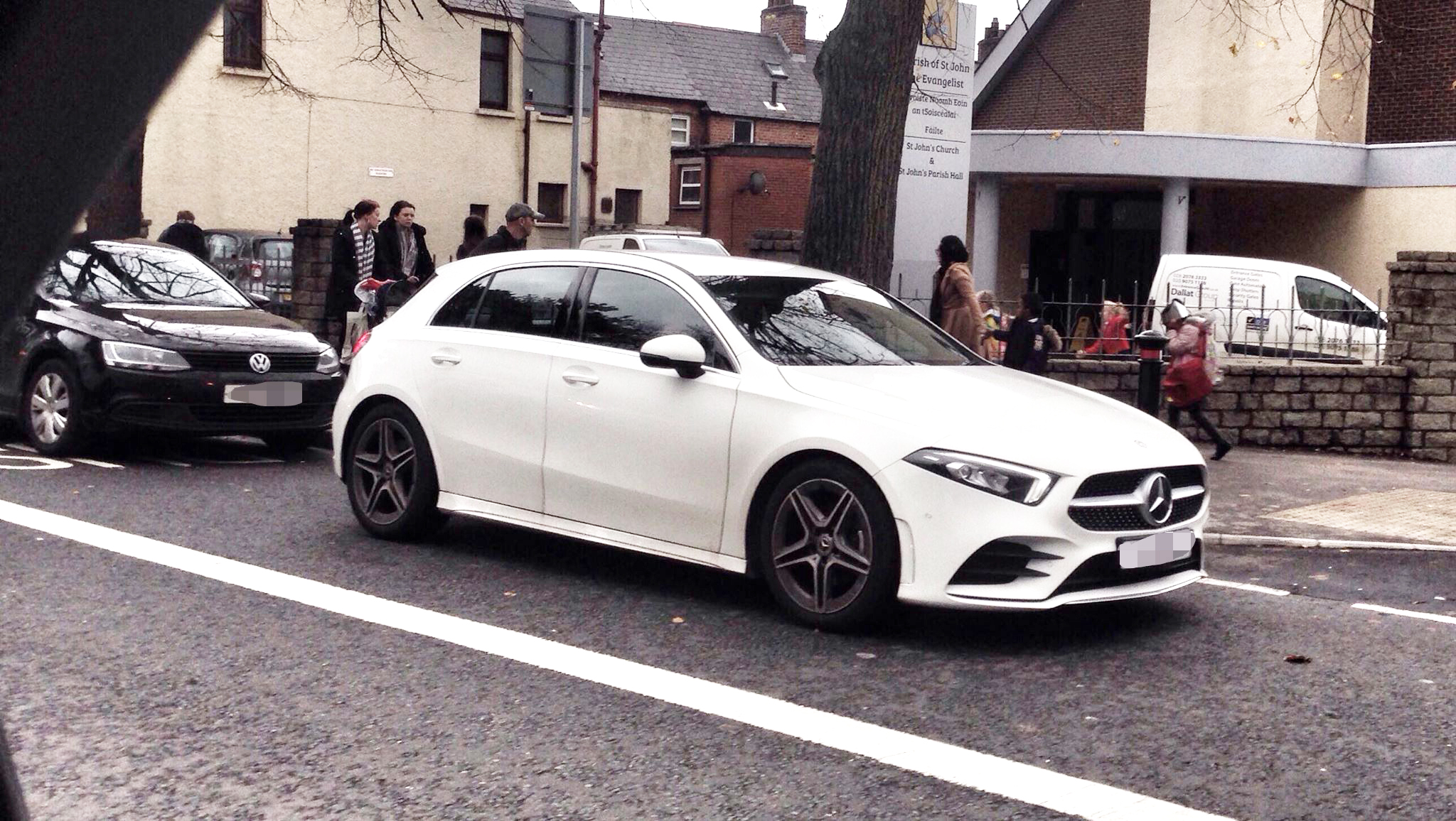 NO-GO: Cars parked on the bus lane on the Falls road outside St Kevin\'s Primary School