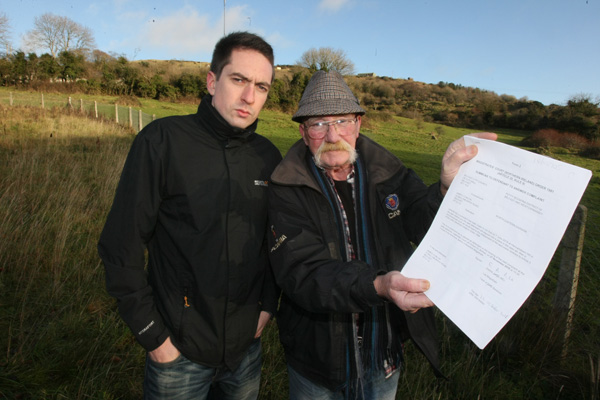 ‘ABSURD’: Seamus Conlon and Cllr Matt Collins with the City Hall summons