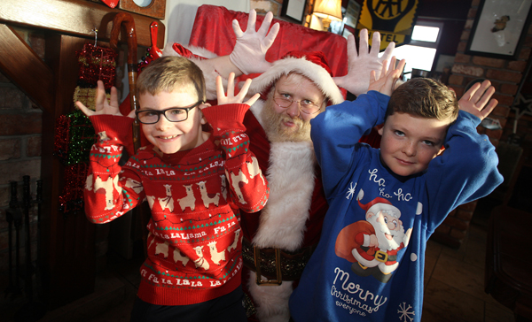 Aidan and Michael McCloskey with Santa at a charity breakfast in the Speckled Hen on the Derriaghy Road