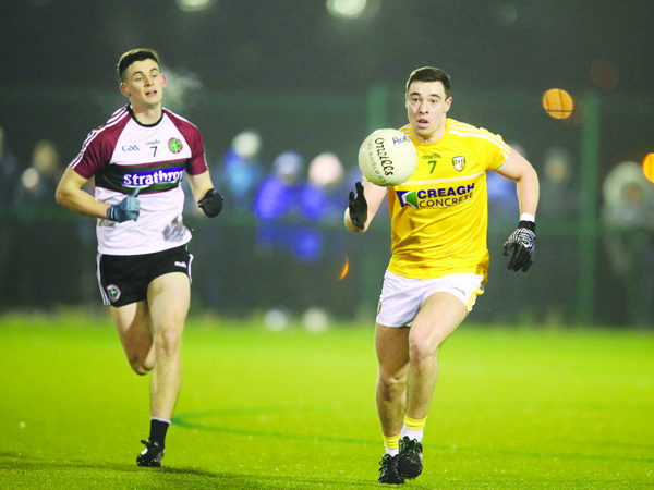 Man-of-the-match Declan Lynch breaks out of defence \nPic by John McIlwaine