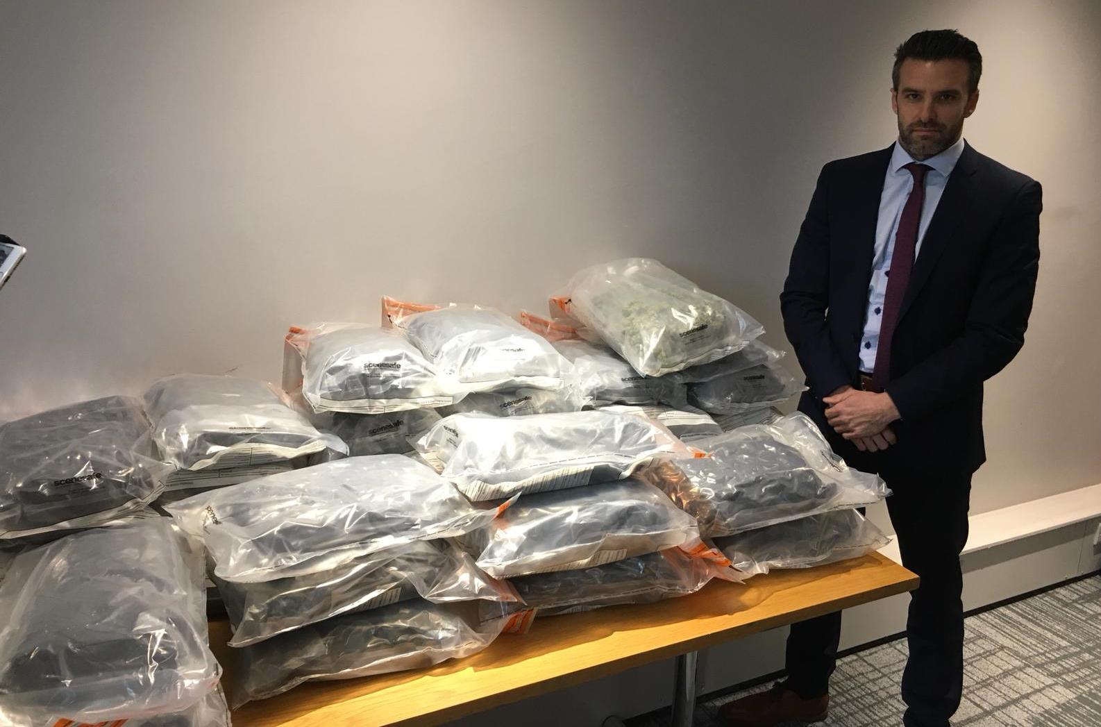 Detective Superintendent Bobby Singleton with approximately 50kg of herbal cannabis with an estimated street value of just under £1million