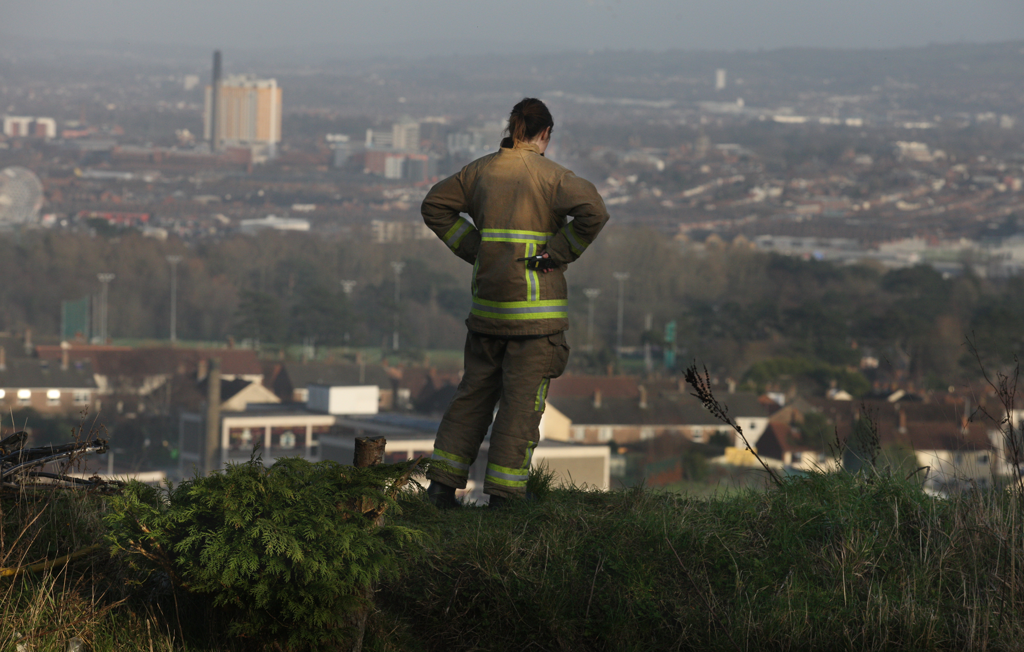 VANTAGE POINT: A firefighter scans the city from the Upper Springfield Road