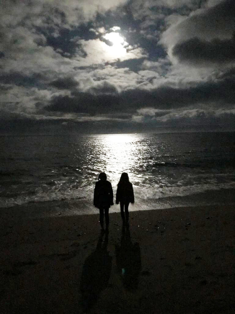 Two Belfast girls enjoy an evening walk along the beach in Cushendall. Pic by Sheena Joyce