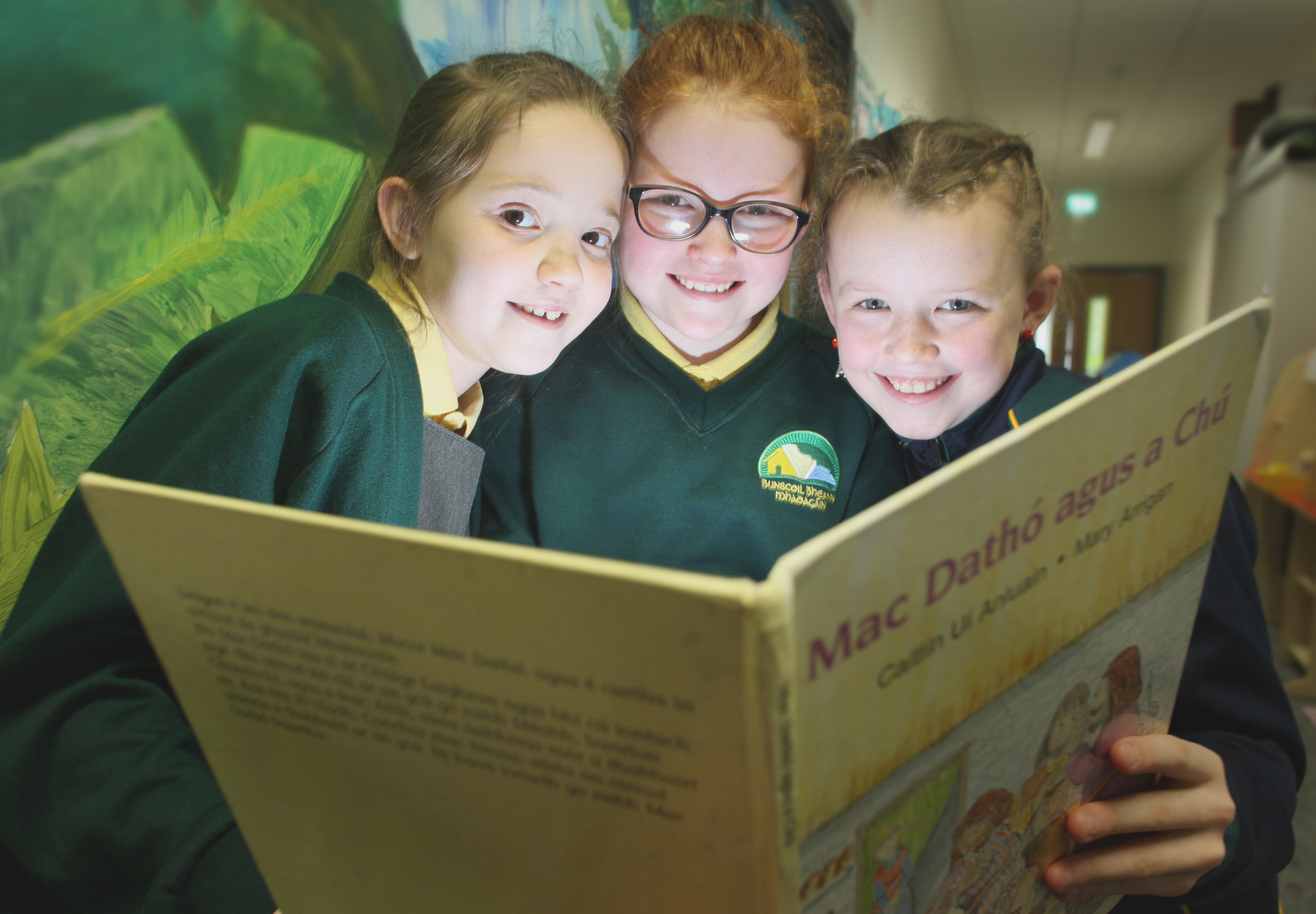 Catching up on a bit of light reading are Bunscoil Bheann Mhadagin pupils Aoibhe Clarke, Cadhla O\' Riordan and Clodagh Brownlee