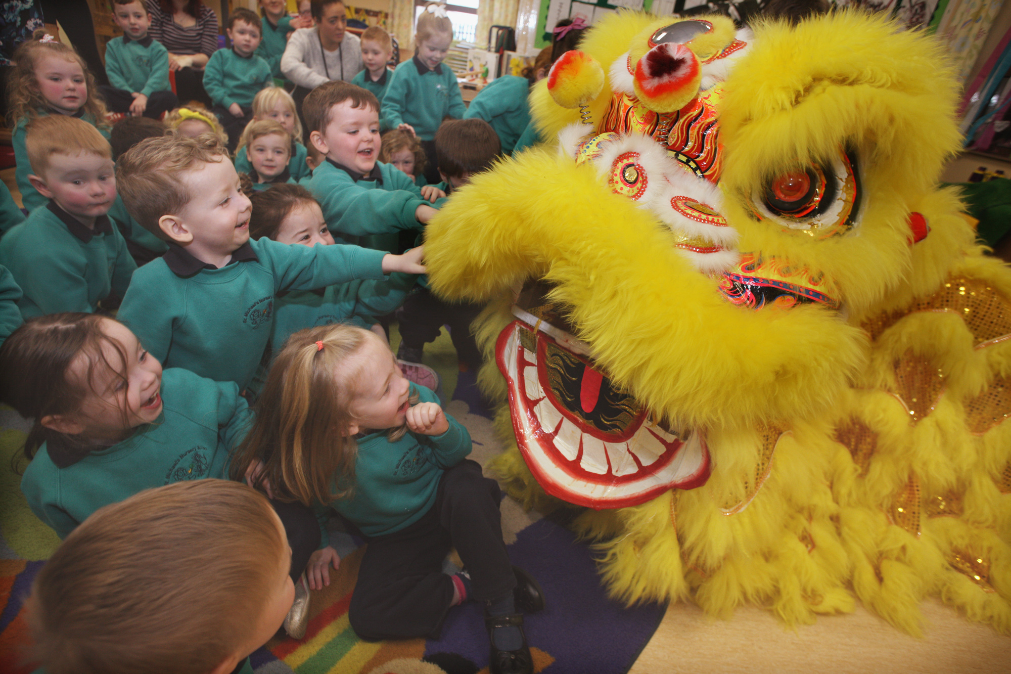 Children at St Michael\'s Nursery School celebrating the Year of the Pig and enjoying Chinese culture with music, dance and storytelling