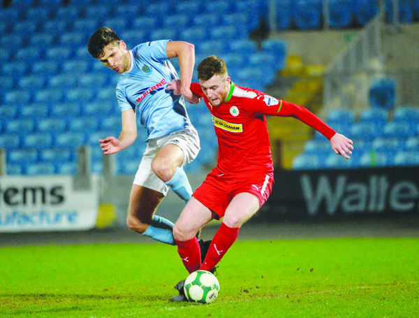 Ballymena\'s Adam Leckey challenges Cliftonville\'s Joe Gorman during Tuesday’s win for the Braidmen