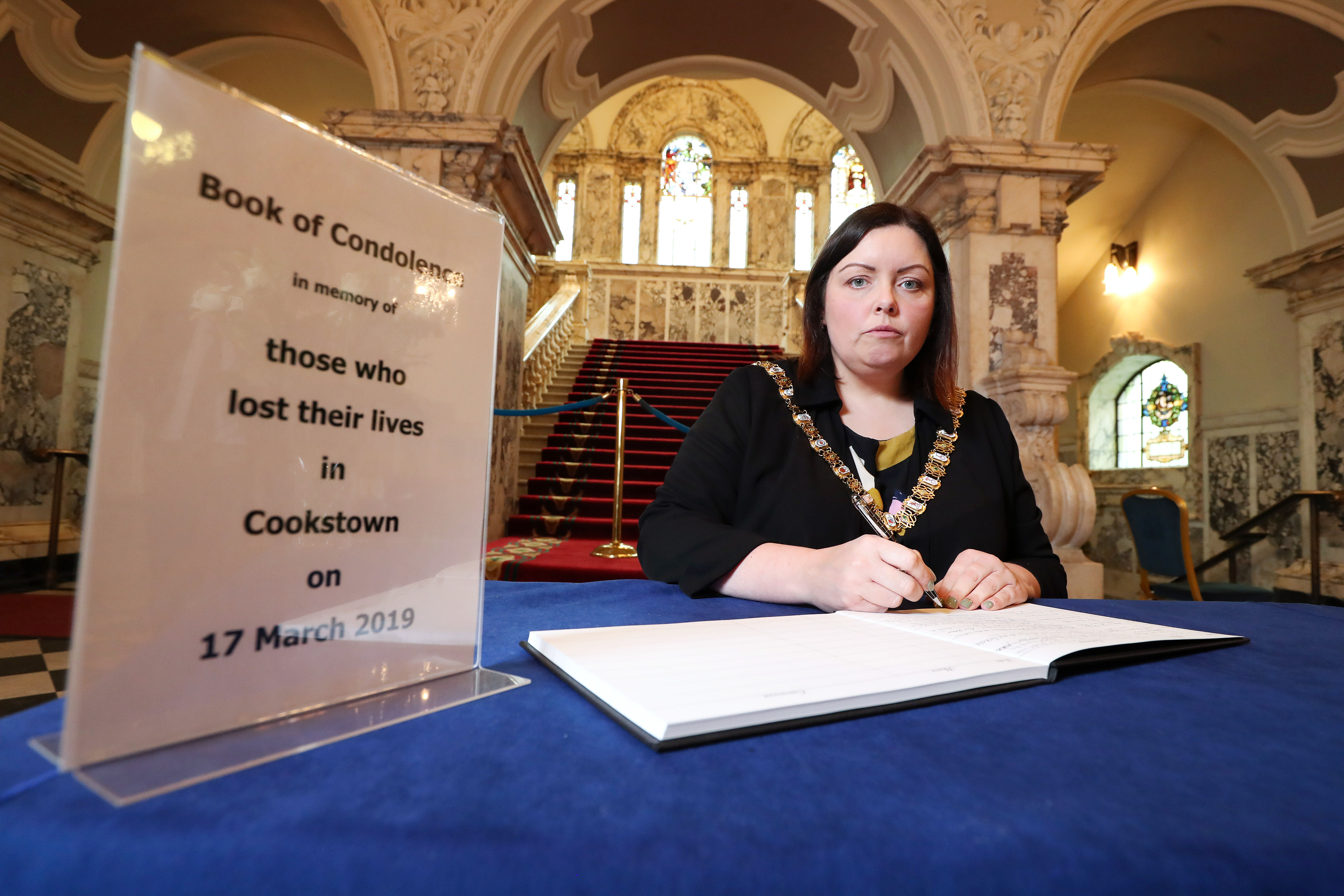 Lord Mayor, Councillor Deirdre Hargey signs the Book of condolence at Belfast City Hall